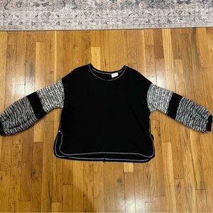 Anthropologie / Deletta black knit top with black and white design on sleeves